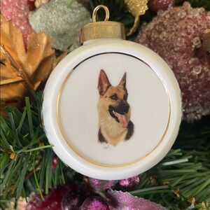 Porcelain Christmas ornament with German Shepherd by artist Robert J May